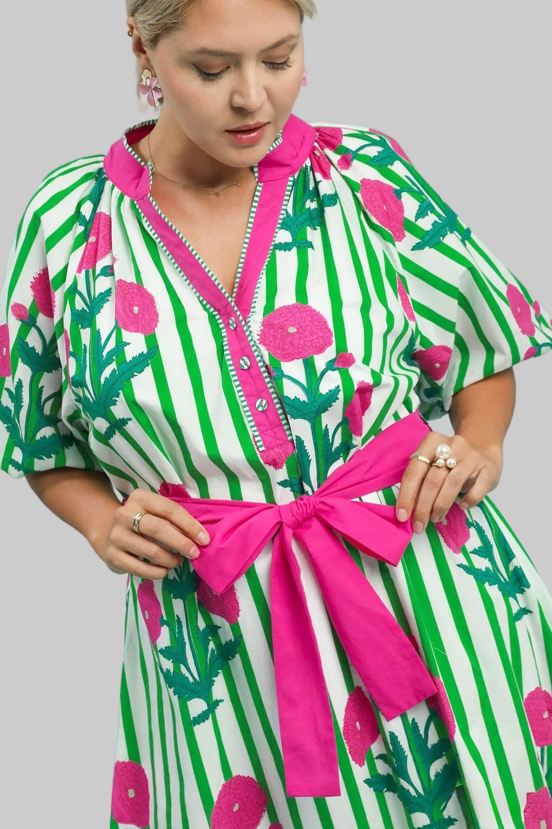 Women's Umgee green and white striped midi dress with pink floral print in plus size showing belted waist
