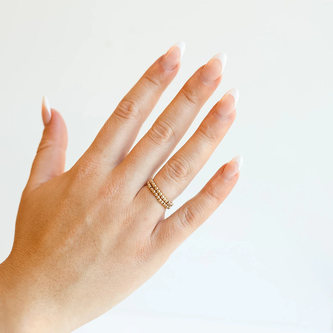 beaded blondes lexi band gold beaded ring. shown stacked with another lexi band