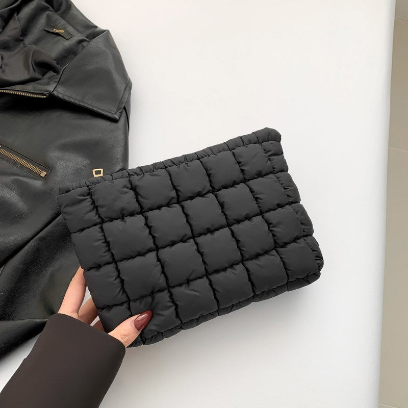 Black quilted puffy makeup bag