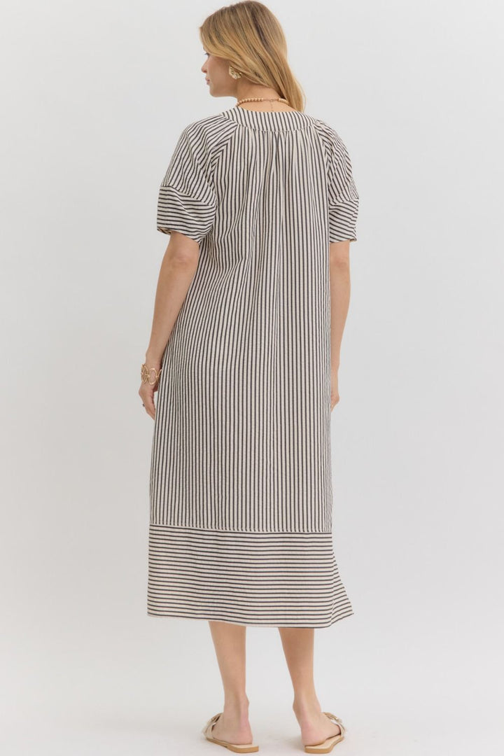 Women's black and white striped fall midi dress, back view