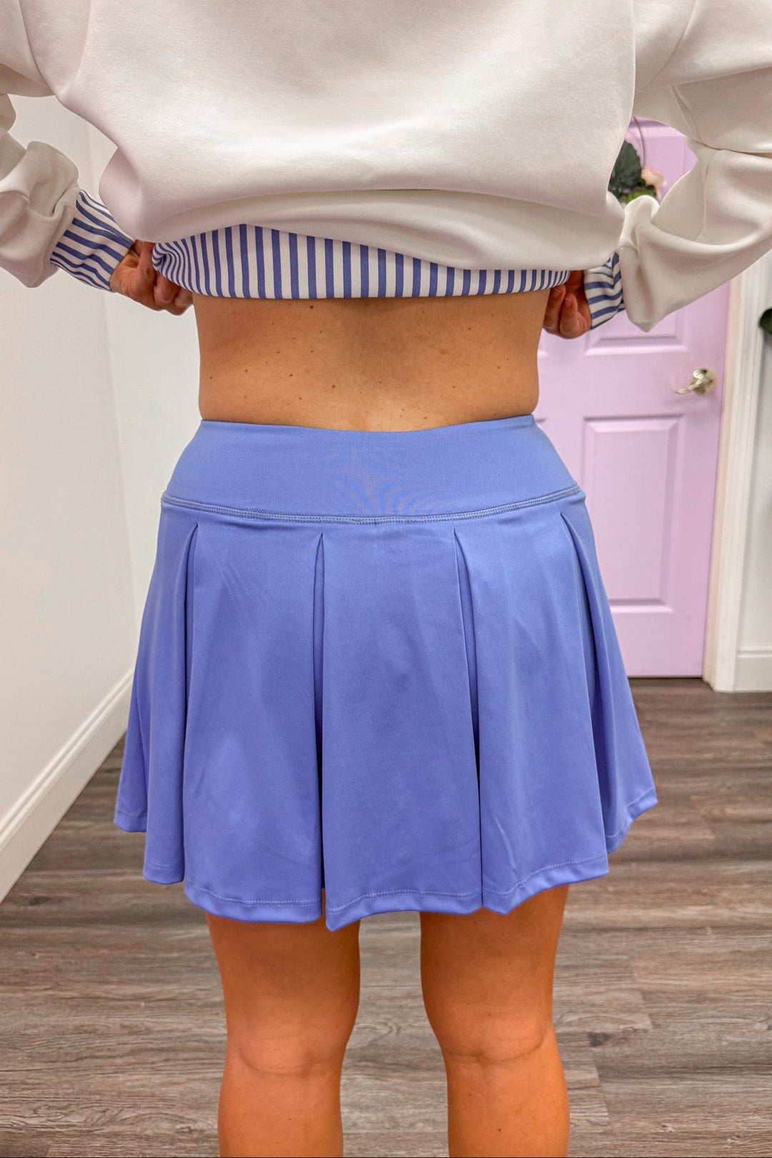 back view of women's blue pleated skort