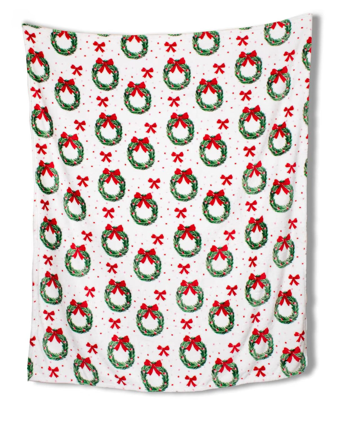 Festive blanket with Christmas wreath and bow pattern on a white background
