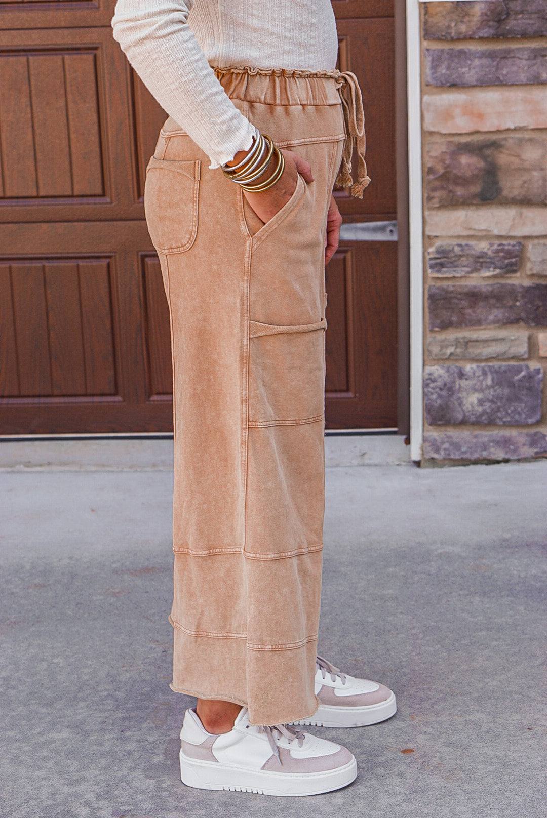 French terry knit wide leg pants in mineral washed caramel by Easel showing up close side view