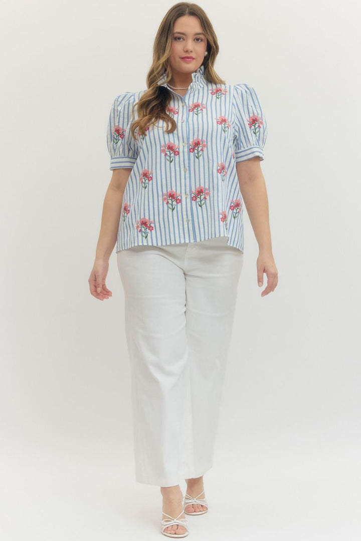 Entro blue and white striped button front top with pink and red embroidered flowers in plus size paired with white pants