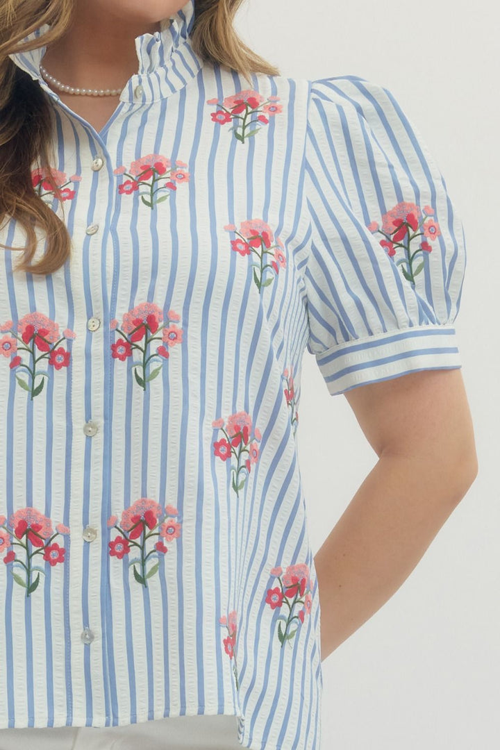 Entro blue and white striped button front top in plus size showing close up view of pink and red embroidered flowers