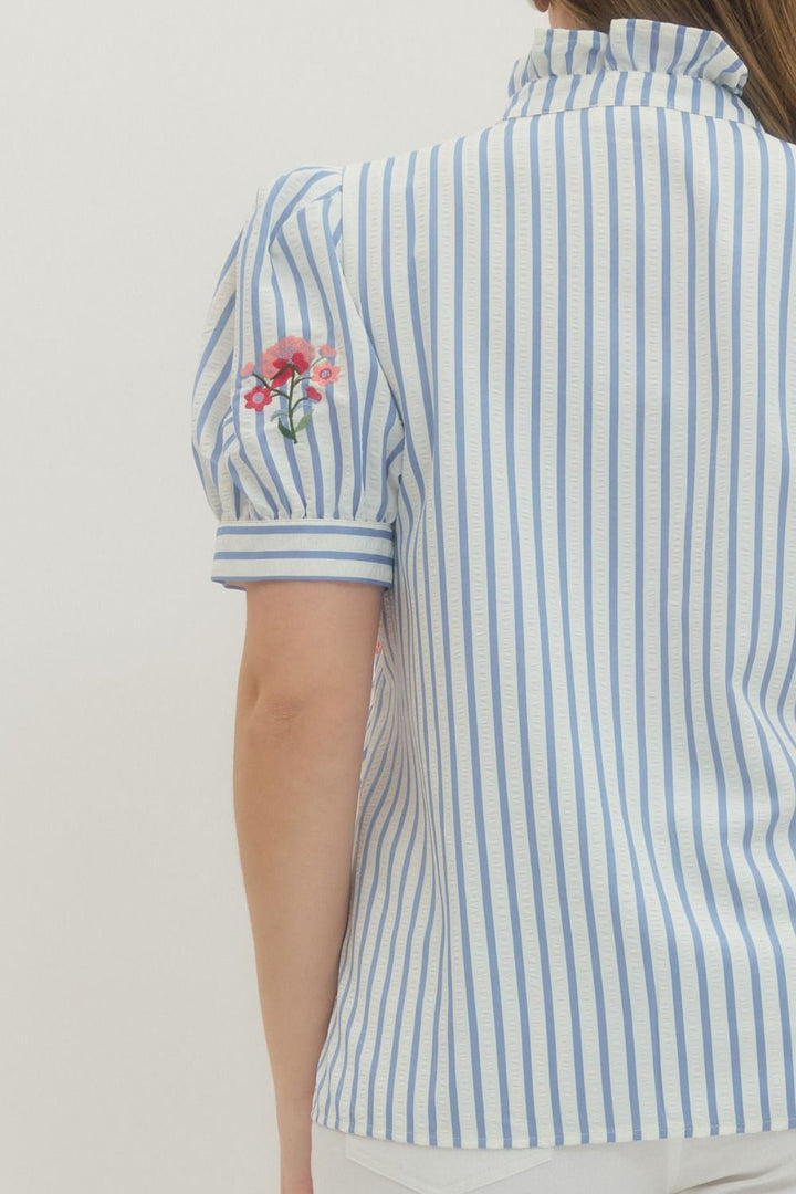 Entro blue and white striped button front top with pink and red embroidered flowers in plus size showing close up view of back