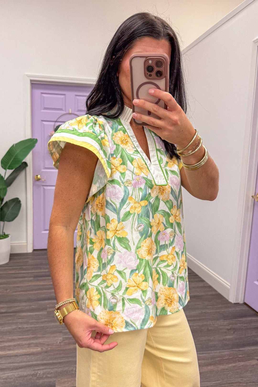 side view of yellow and green floral short sleeve blouse