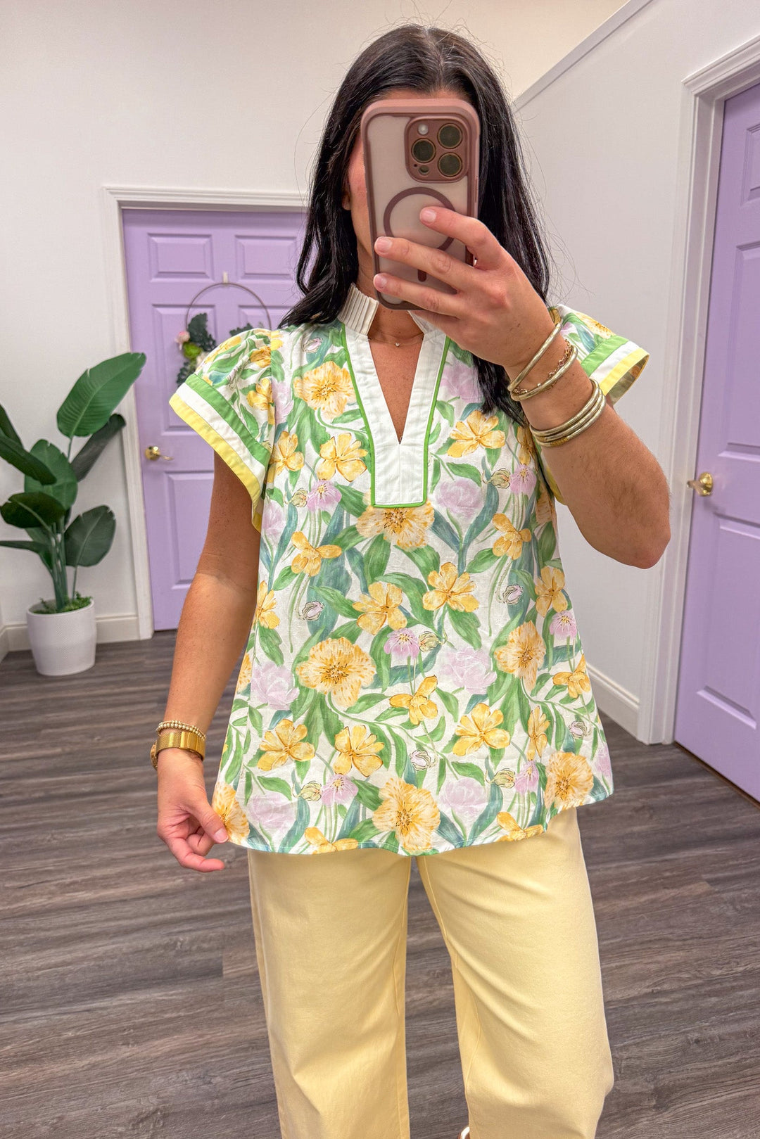 Women's yellow and green floral printed short sleeve top paired with yellow twill pants