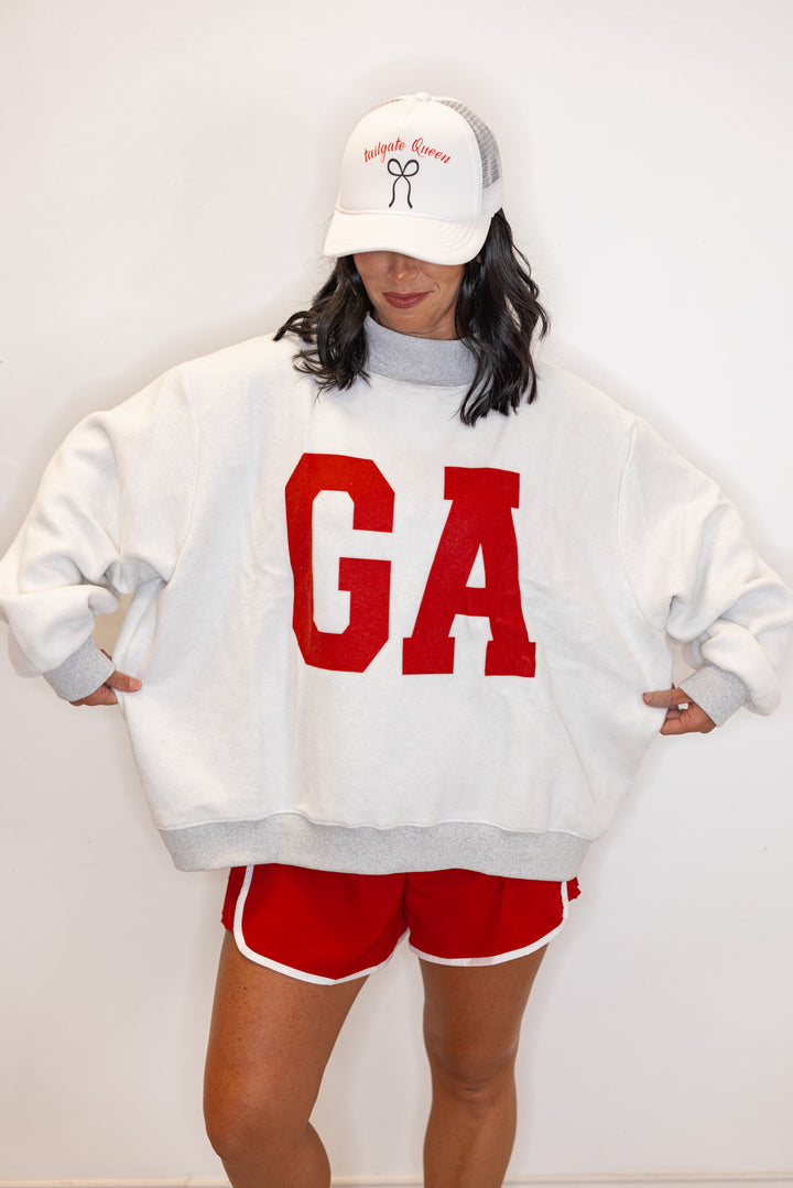 Women's "Georgia/GA" sweatshirt in reversible grey and red or white and red by BucketList showing oversized fit