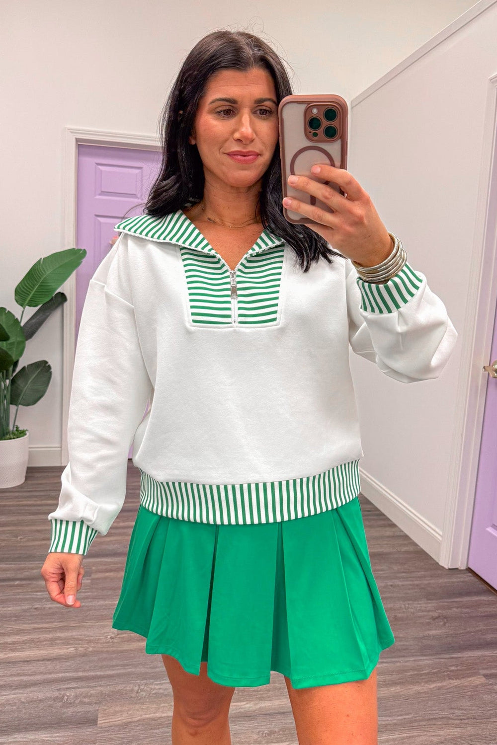 Women's green pleated athleisure skort set