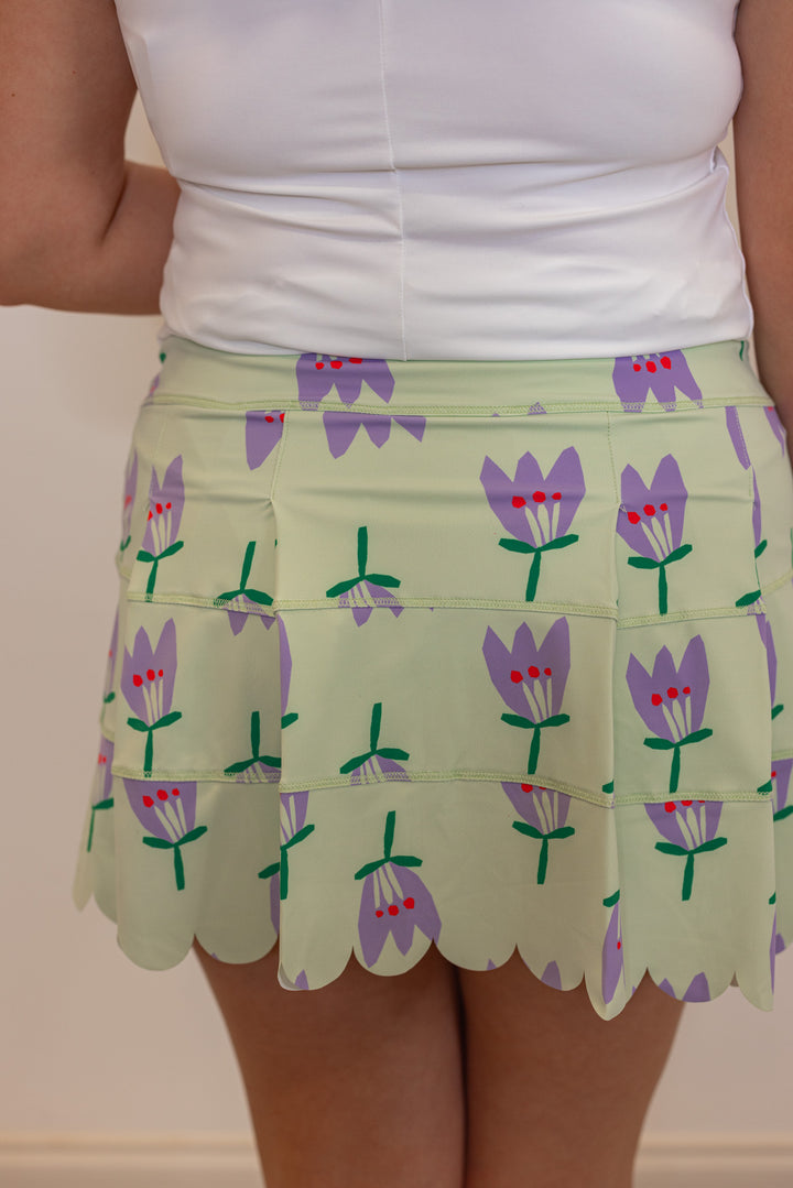 Women's mint green and purple poppy floral print scalloped skort lined with shorts by Karlie showing up close back view