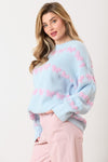 Light blue sweater striped with textured lavender/pink bow ties