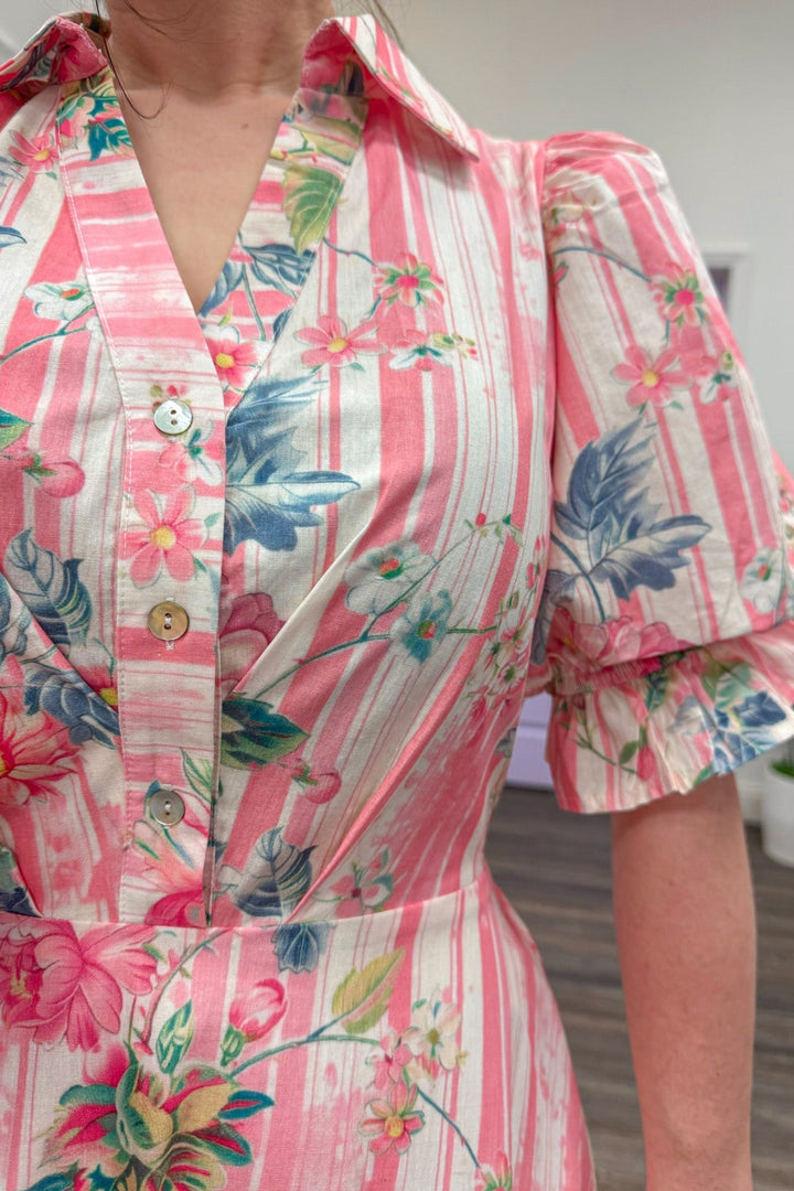 close up of pink floral striped midi with front button closure