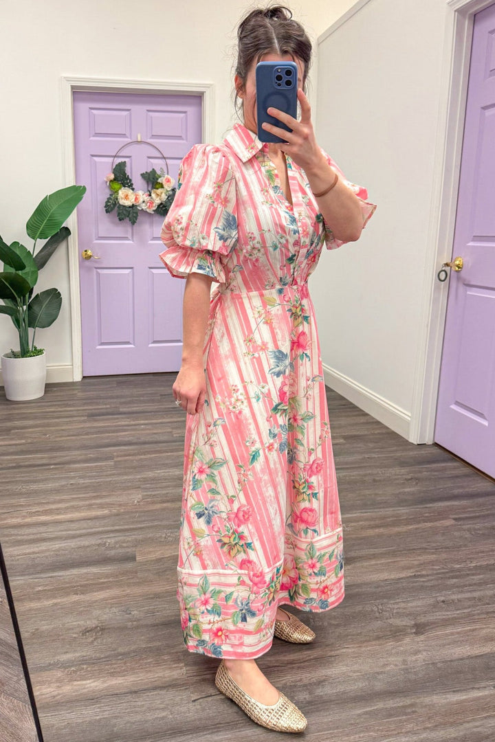 Side view of pink striped floral midi with puff short sleeve