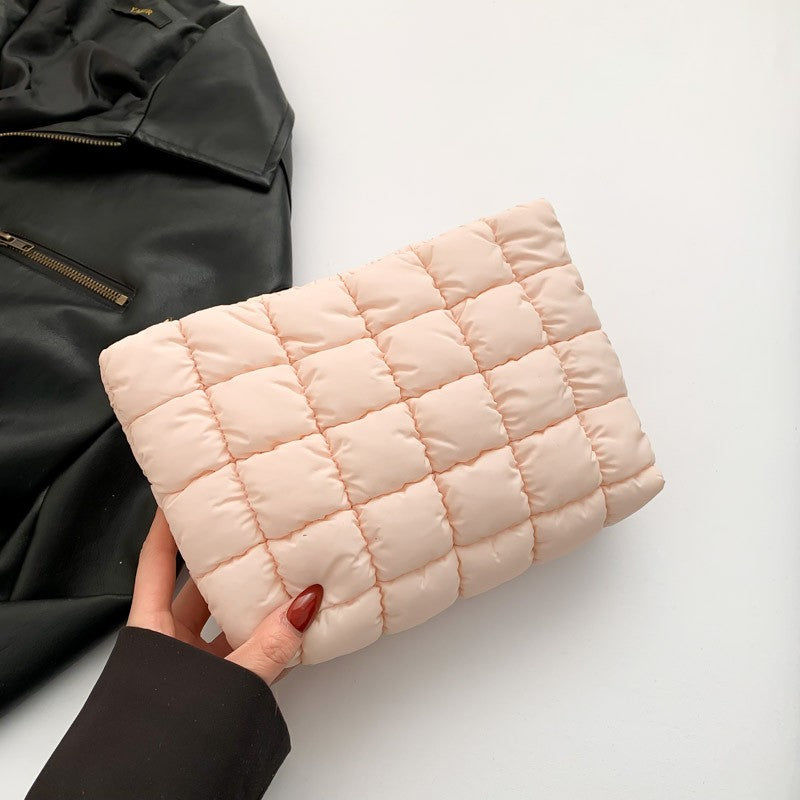 Light pink quilted puffy makeup case