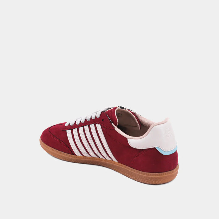 inside view of Maroon sneaker with white stripes 