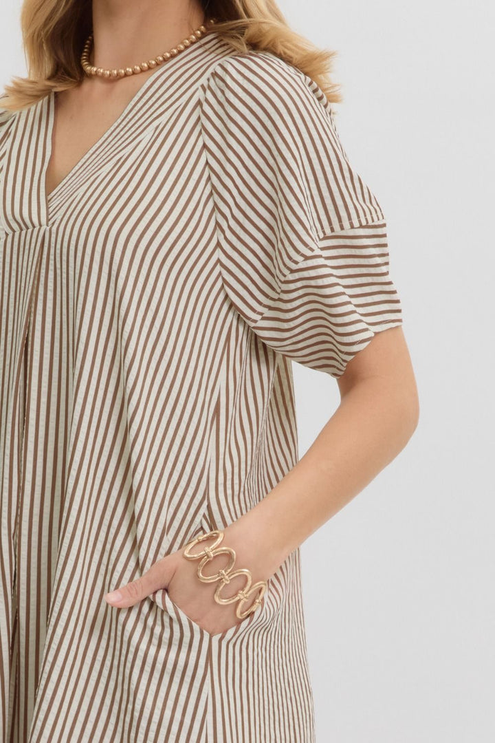 Women's brown and ivory striped fall midi dress, close up showing pockets