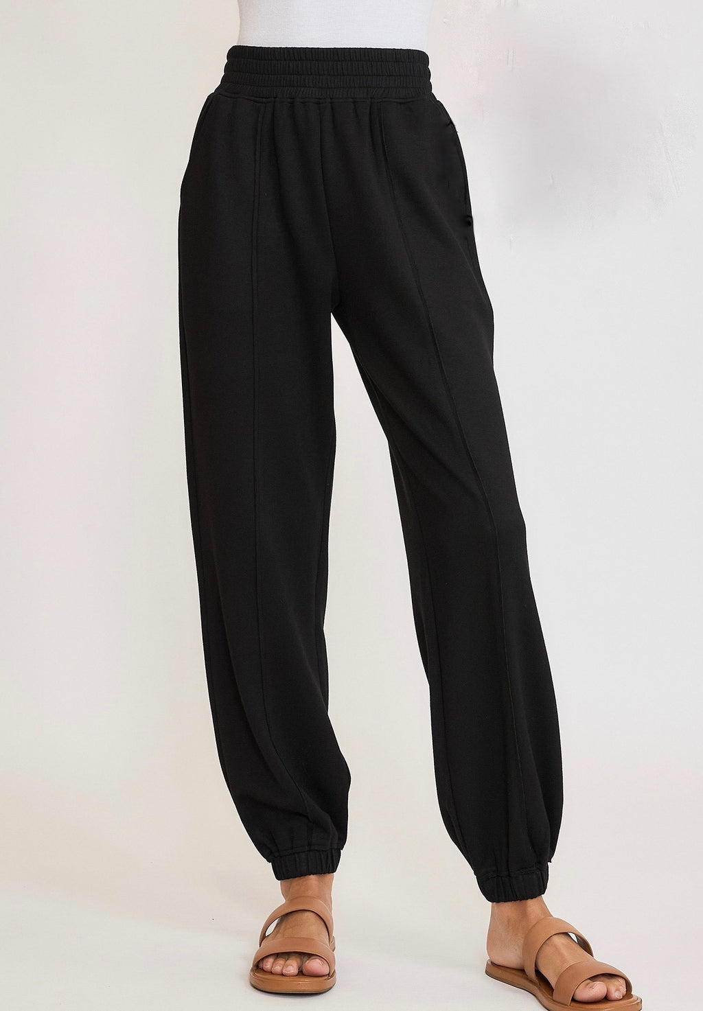 Umgee Black scuba luxe knit elastic waist jogger pants with raw/reverse seam details