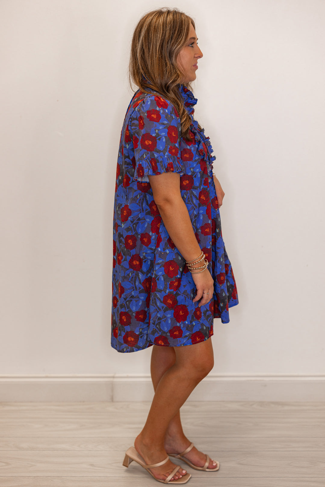 Women's dark blue and burgundy floral dress with pleated bodice and ruffle details by Entro showing full side view