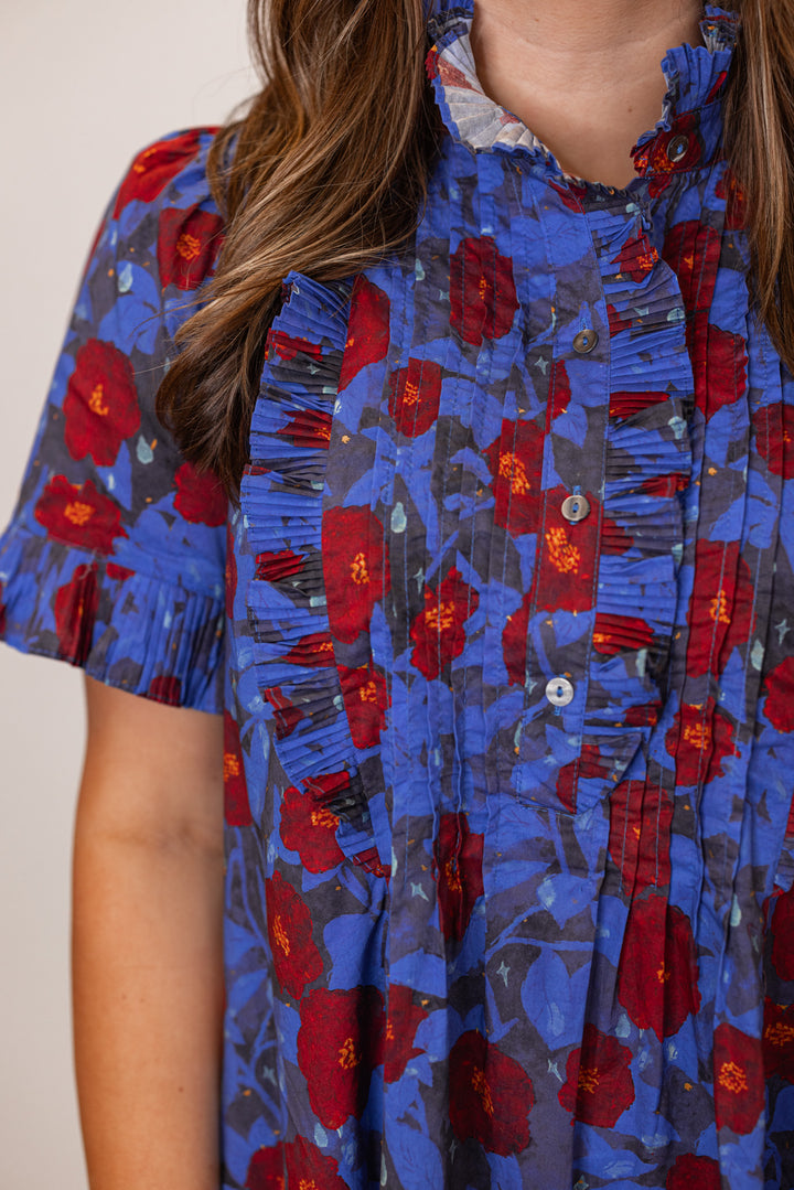 Women's dark blue and burgundy floral dress by Entro showing ruffles and pleated details on front bodice