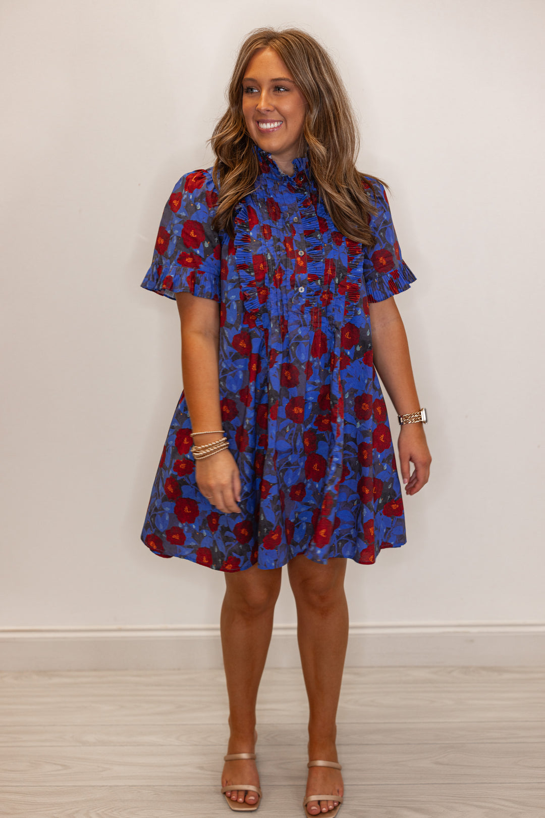 Women's dark blue and burgundy floral dress with pleated bodice and ruffle details by Entro