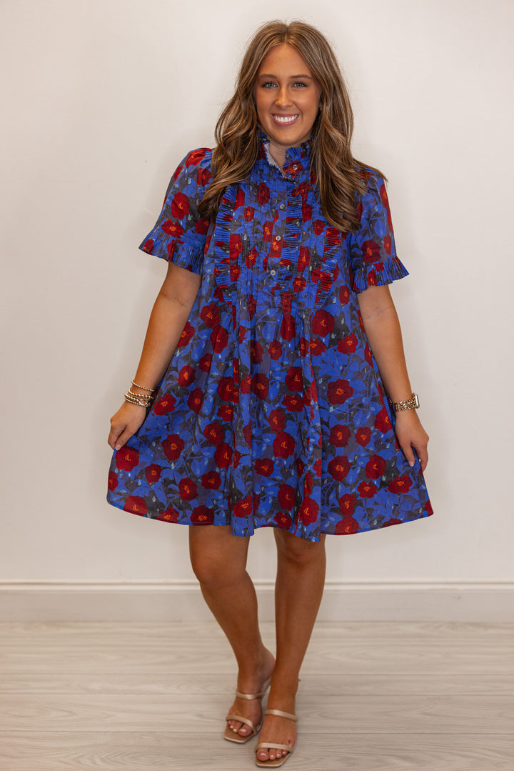 Women's dark blue and burgundy floral dress with pleated bodice and ruffle details by Entro showing full front view