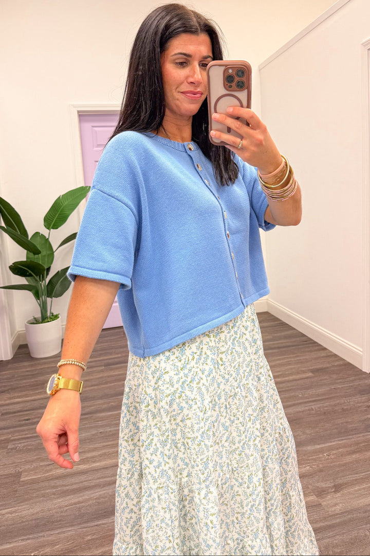 blue crew neckline drop shoulder short sleeve button front knit top