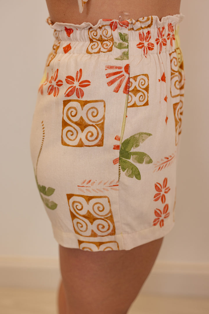 Women's multicolored tropical print linen matching set by Illa Illa showing side view of shorts