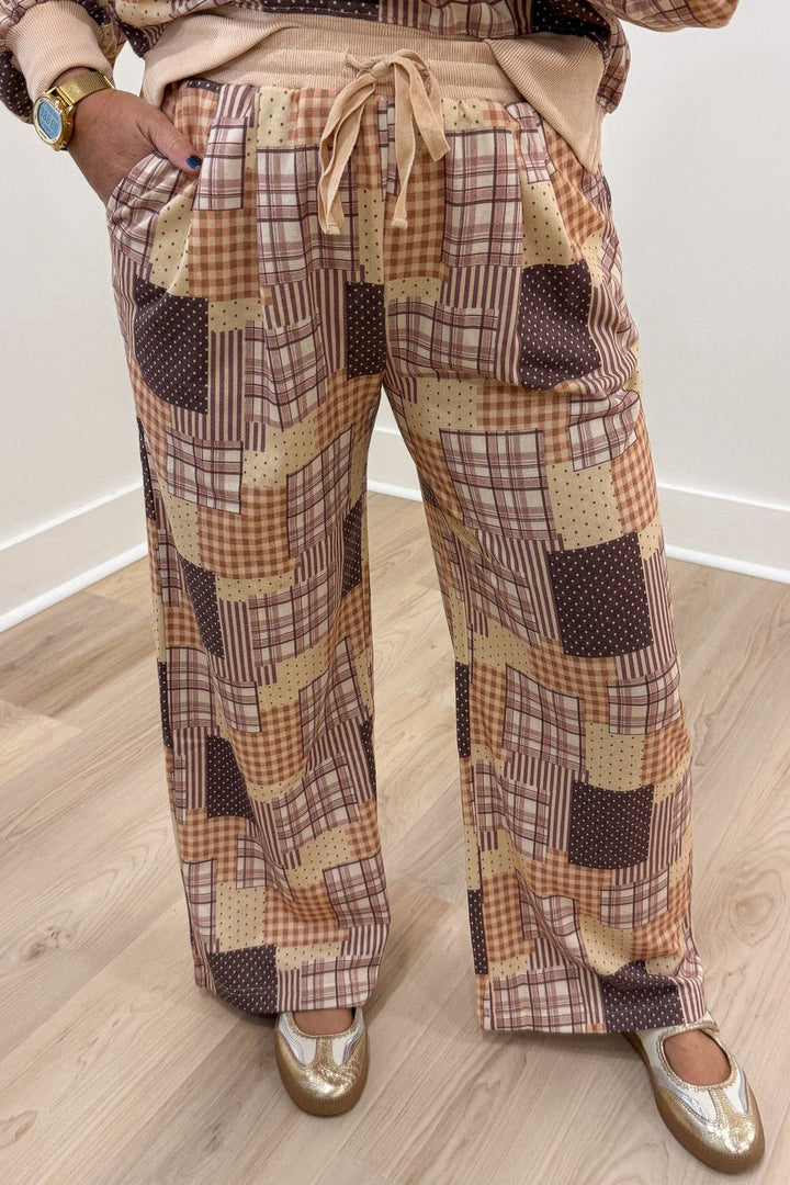 beige brown and multicolored patchwork print top and drawstring pants french terry knit matching set