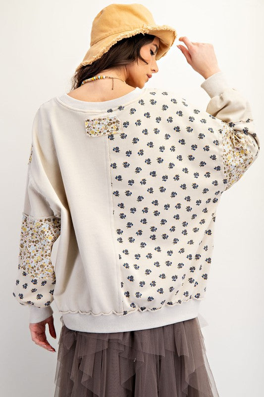 Women's beige french terry knit pullover top with patchwork floral print by easel