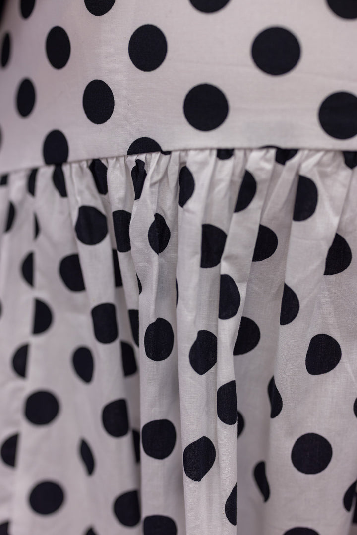 Women's black polka dot maxi skirt by Day + Moon showing polka dot pattern