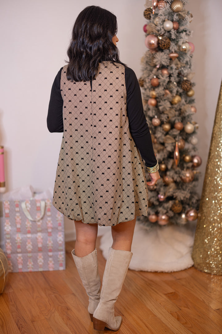 Women's brown, taupe and black gingham bubble hem dress with black bow ties by Glam showing full back view