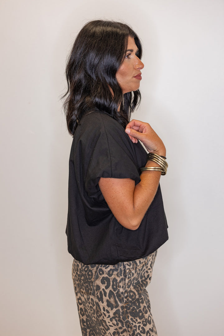 Black knit semi-cropped top with bubble hem by Wishlist showing up close side view