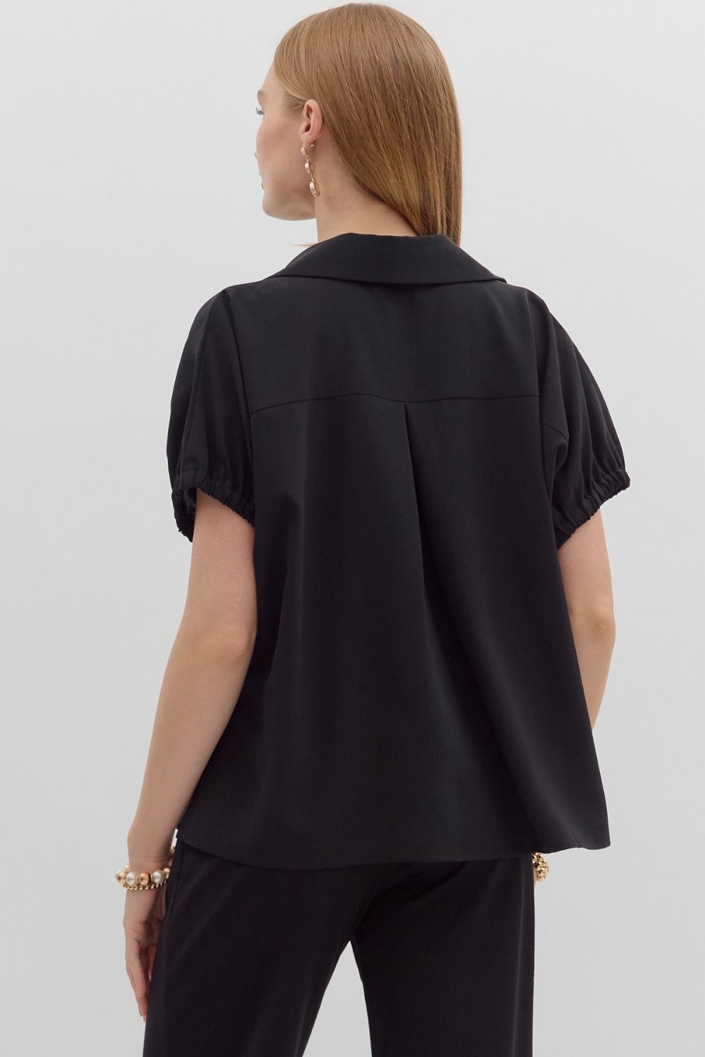 Women's black short sleeve top by Entro showing back view