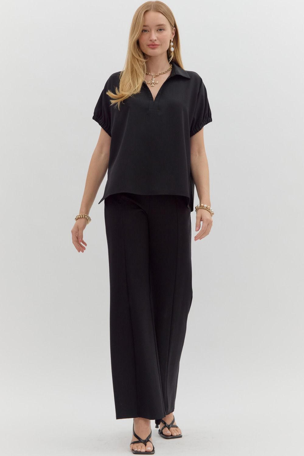 Women's black short sleeve top by Entro showing full front view