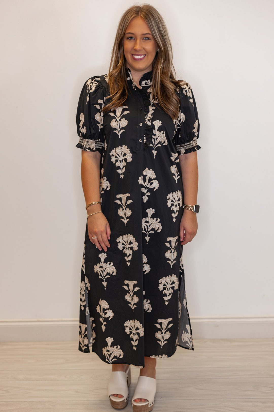 Women's black midi dress with taupe botanical floral print and ruffle detail