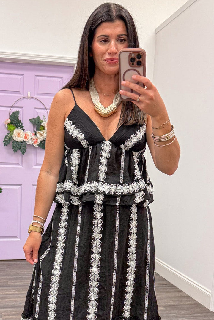 black with cream embroidered striped details sleeveless v neckline peplum top
