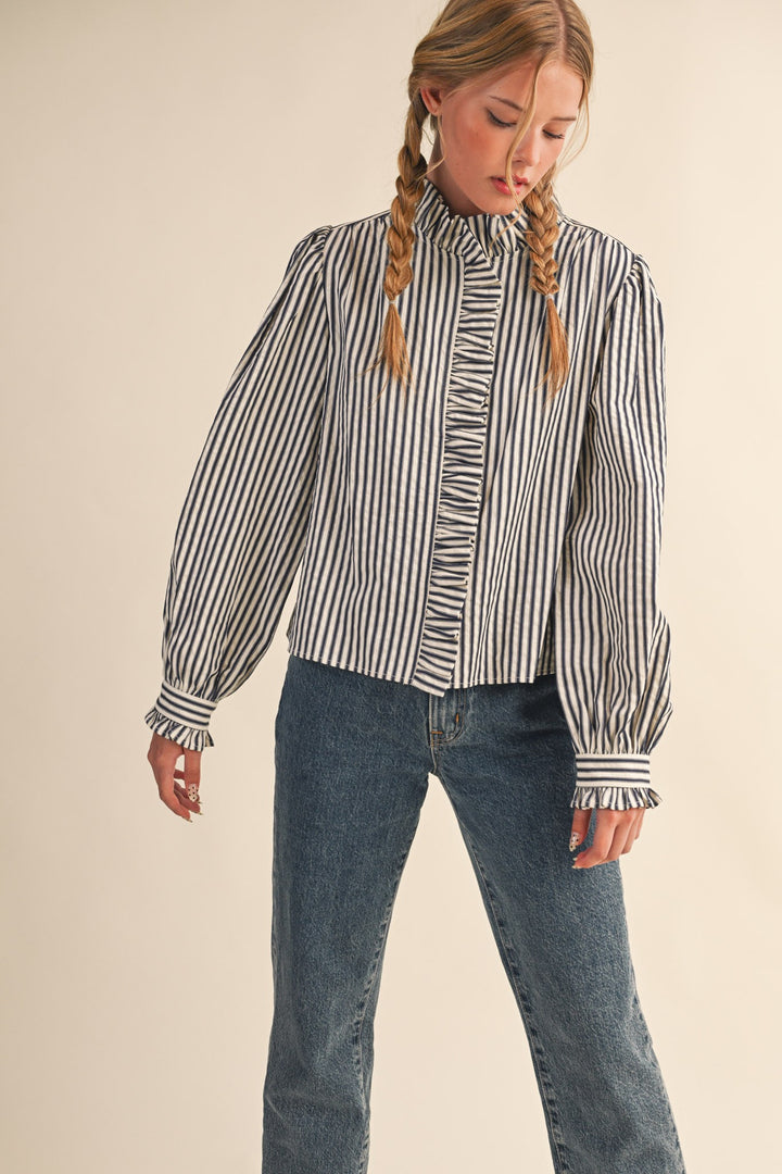 Women's black and cream striped button front top with ruffle trim details by &merci showing front view
