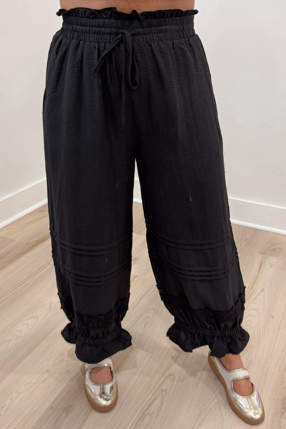 solid black ruffle trimmed elastic waist wide leg cropped pants with elastic ruffle cuffed ankles