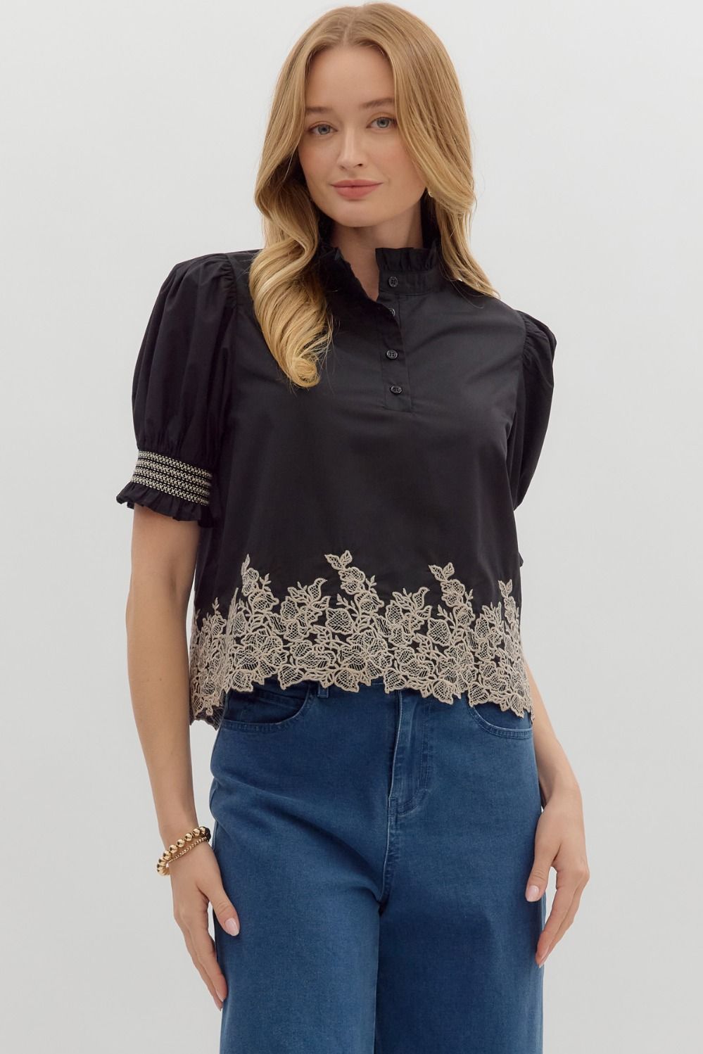 Women's black puff sleeve top with cream embroidered floral details by Entro