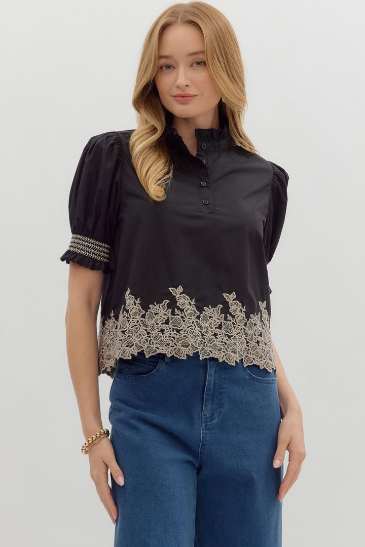 Women's black puff sleeve top with cream embroidered floral details by Entro
