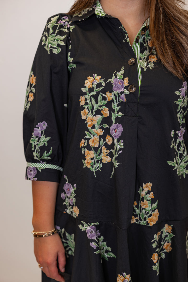 Close up of black poplin floral babydoll dress