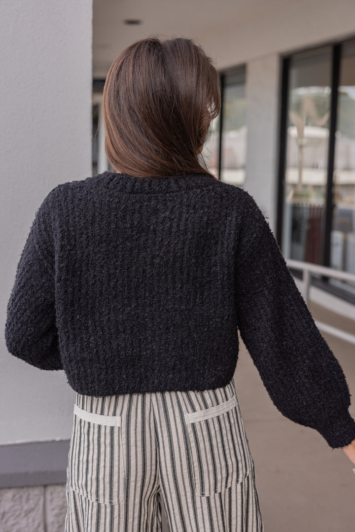 Women's black fuzzy knit textured button front sweater cardigan by hyfve showing back view