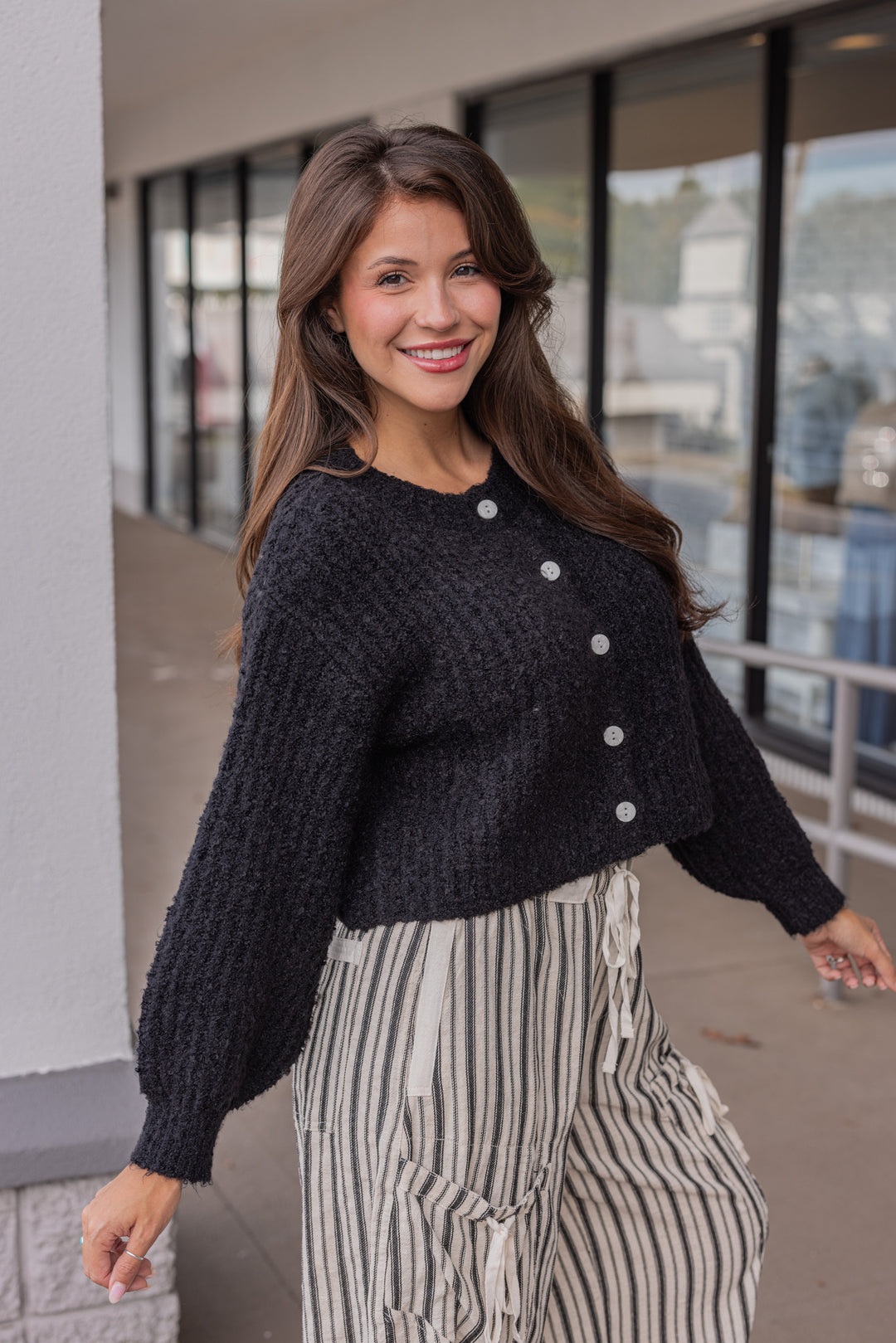 Women's black fuzzy knit textured button front sweater cardigan by hyfve showing side view