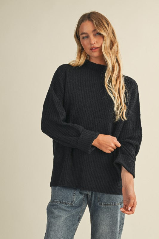 Women's black ribbed knit mock neck sweater top with side slits by Mustard Seed