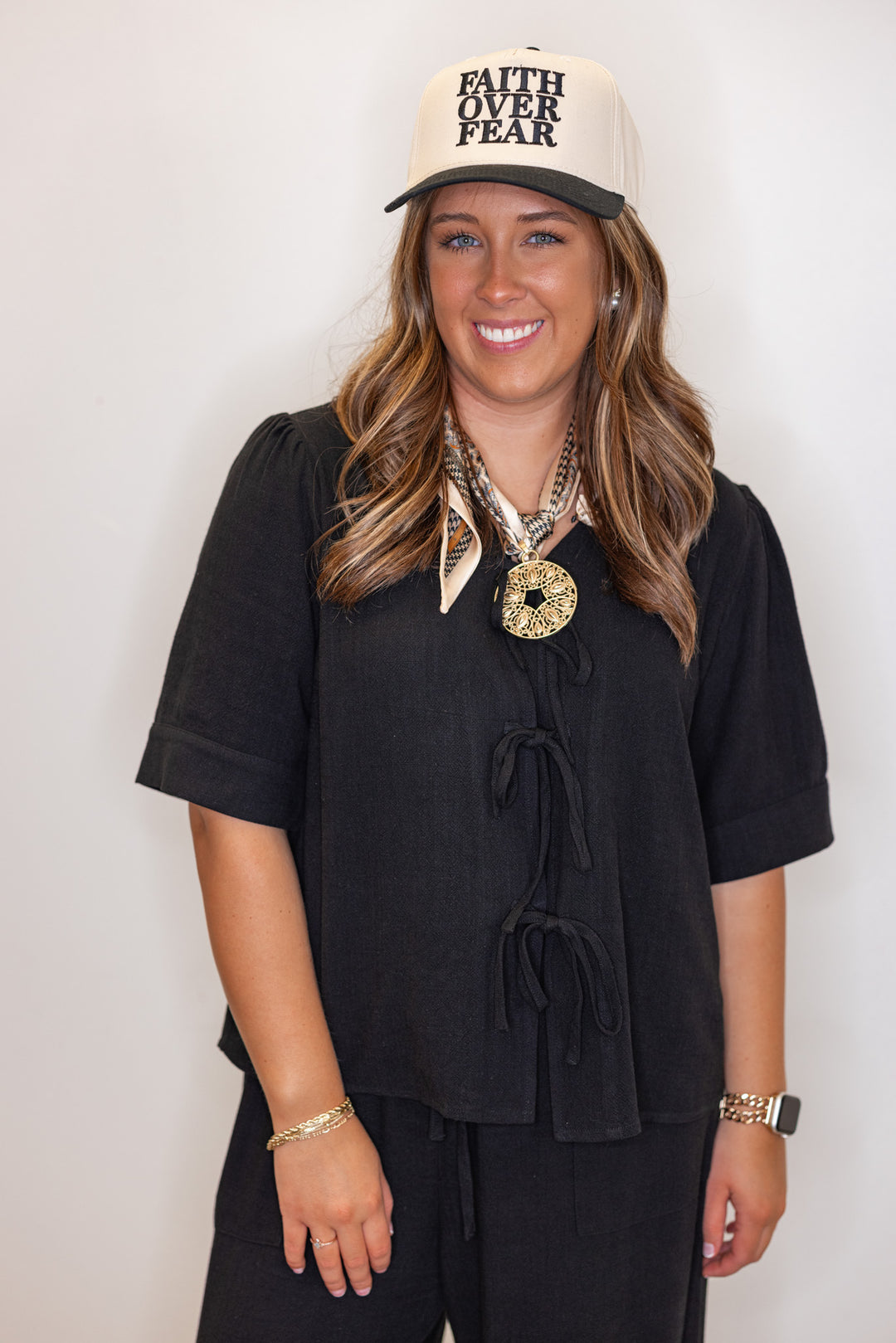 Women's black linen bow tie top and elastic waist wide leg pants set by Jodifl  showing up close front view of top