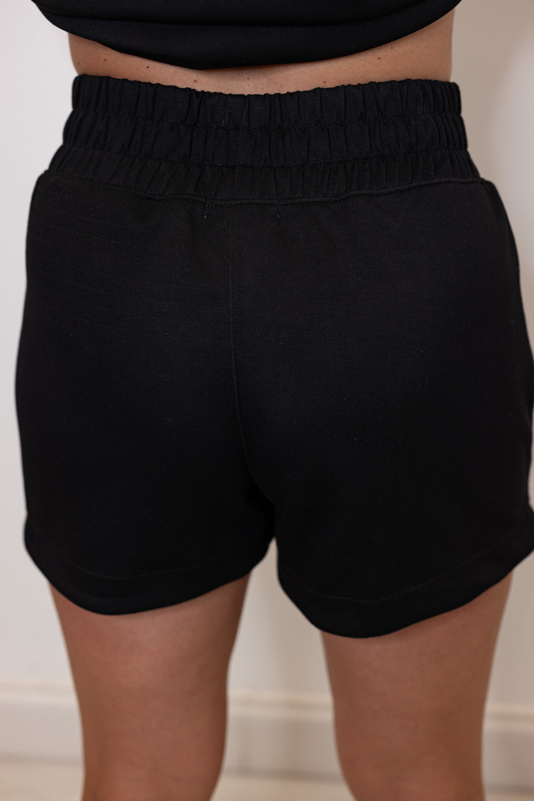 women's black scuba knit wide band shorts back
