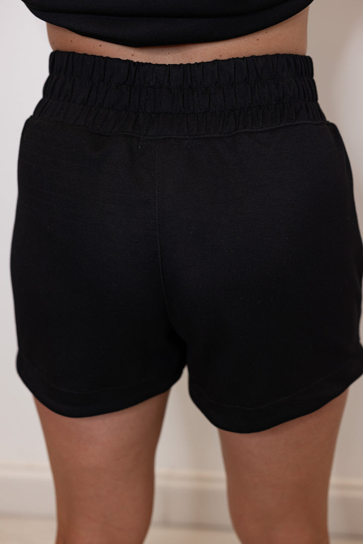 women's black scuba knit wide band shorts back