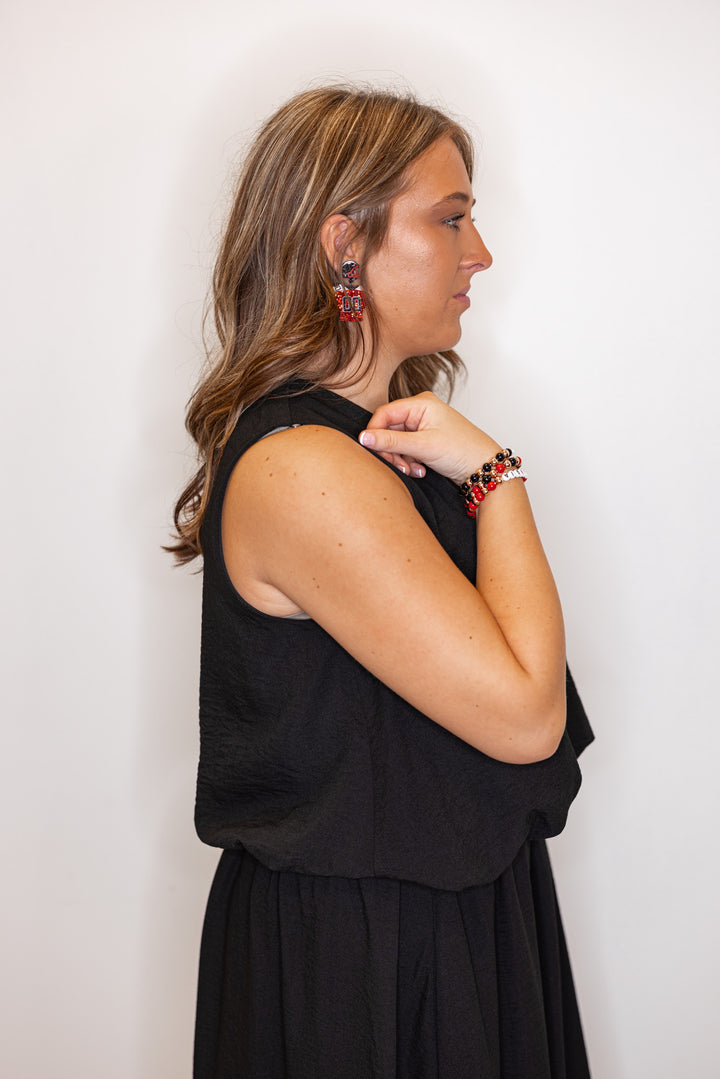 Women's black textured bubble hem sleeveless crop top by Entro showing up close side view