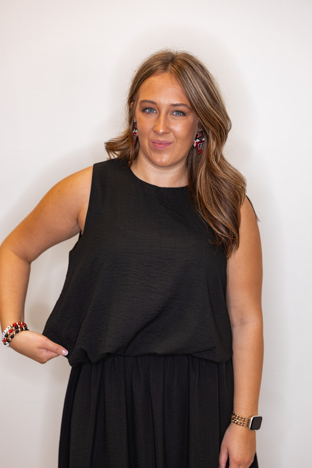 Women's black textured bubble hem sleeveless crop top by Entro showing up close front view